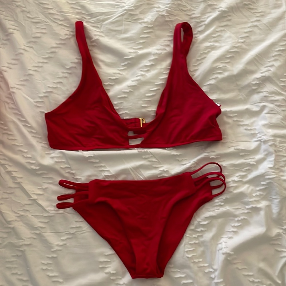 Used L*Space red swimsuit bikini set.  Top size D. Bottom size SMALL